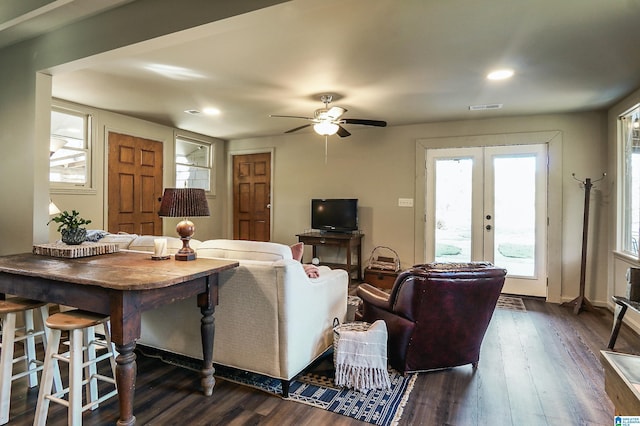 living room with ceiling fan, dark hardwood / wood-style flooring, and french doors