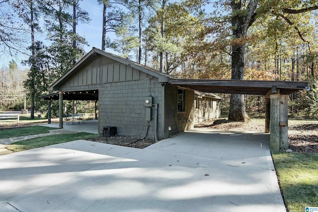 view of property exterior featuring a carport