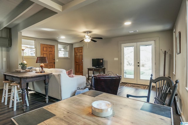 dining area with french doors, dark hardwood / wood-style floors, and a healthy amount of sunlight