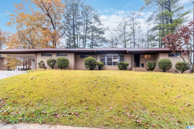 ranch-style house with a carport and a front lawn