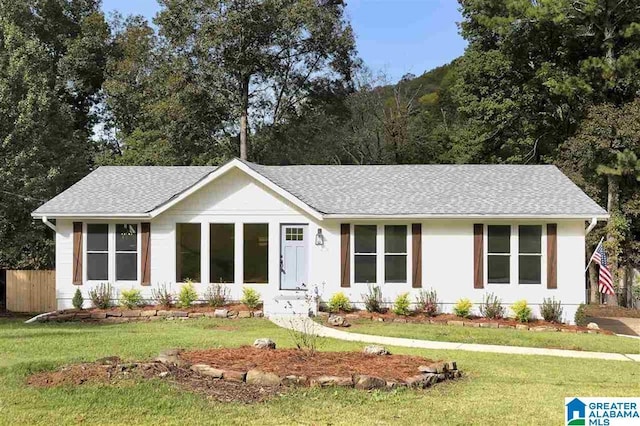 ranch-style house with a front yard