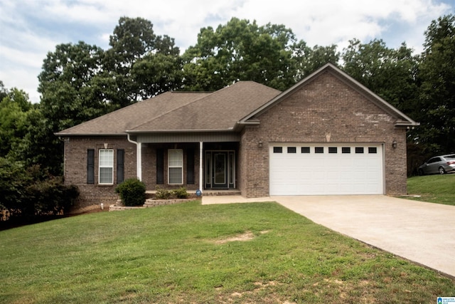 view of front of house featuring a garage and a front lawn