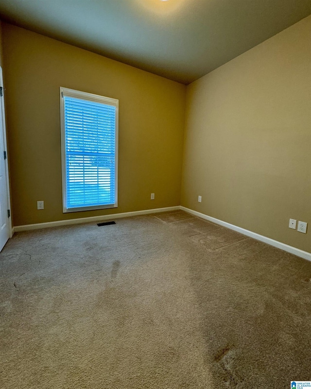 view of carpeted spare room