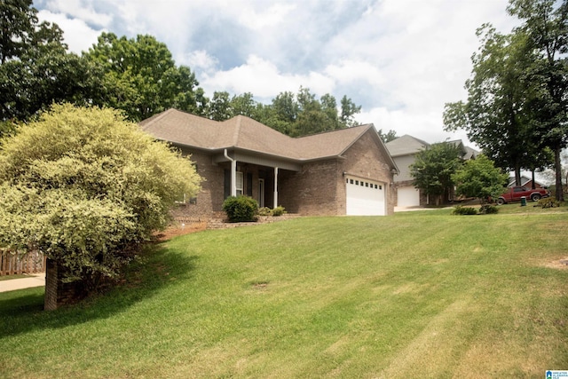 single story home with a garage and a front lawn