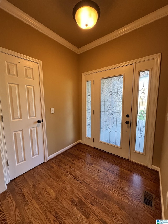 entrance foyer featuring dark hardwood / wood-style flooring and crown molding