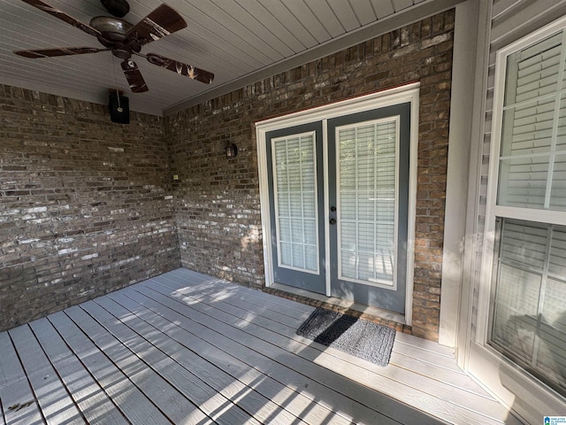 wooden terrace with french doors and ceiling fan