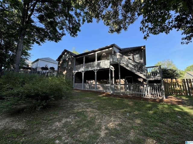 rear view of house with a lawn