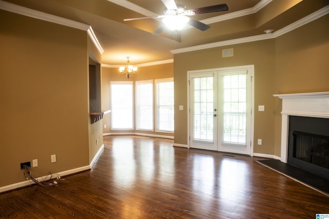 unfurnished living room with crown molding, french doors, dark wood-type flooring, and ceiling fan with notable chandelier