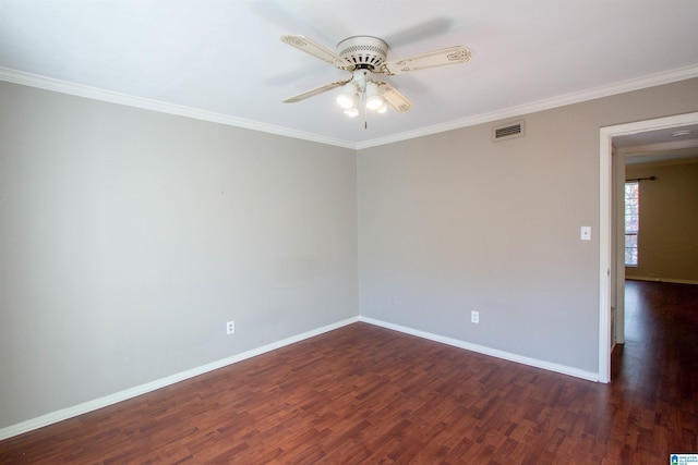 empty room featuring dark hardwood / wood-style floors, ceiling fan, and crown molding