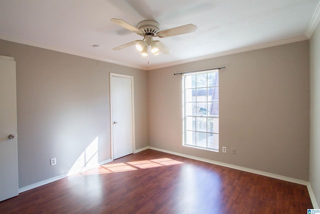 spare room featuring hardwood / wood-style flooring, ceiling fan, and crown molding