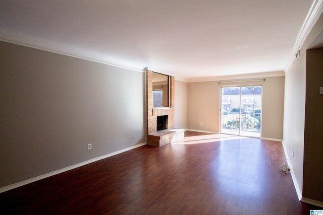 unfurnished living room featuring a fireplace, dark hardwood / wood-style flooring, and crown molding