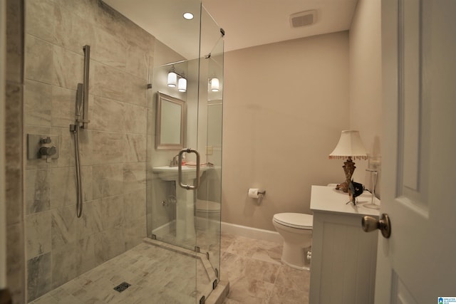 bathroom with vanity, toilet, and walk in shower