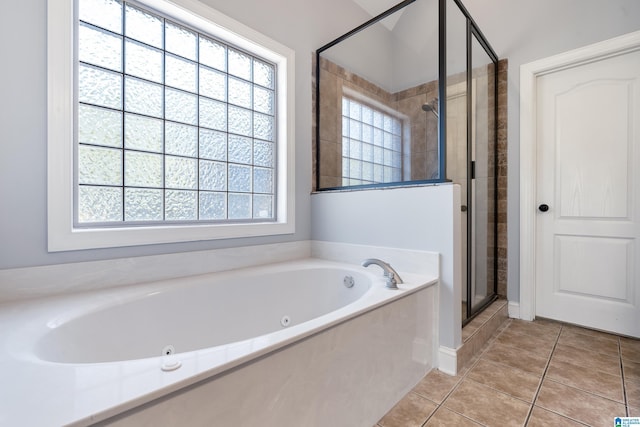 bathroom featuring tile patterned flooring and independent shower and bath