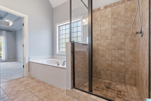 bathroom featuring a raised ceiling, plenty of natural light, shower with separate bathtub, and ornamental molding