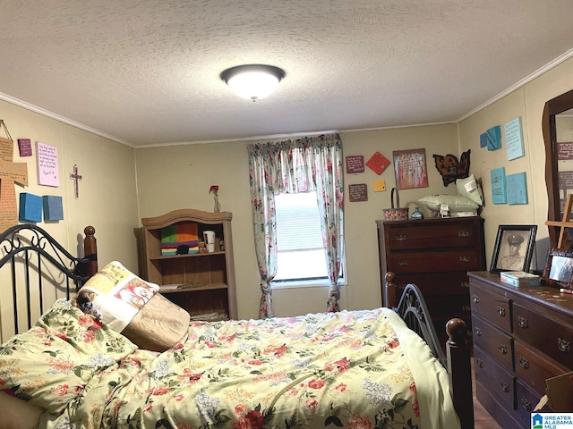 bedroom featuring ornamental molding and a textured ceiling