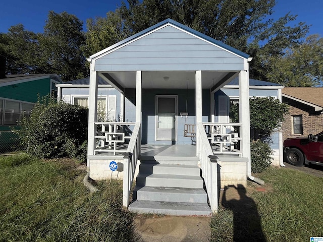 view of front of property featuring covered porch