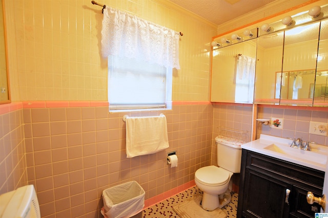 2041 Parkview Rd, Pelham, AL 35124 - bathroom featuring tile walls, ornamental molding, vanity, and tile patterned flooring