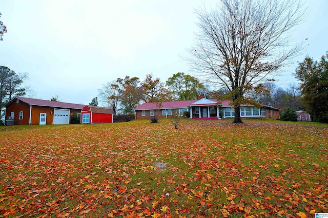 view of front of home featuring an outbuilding