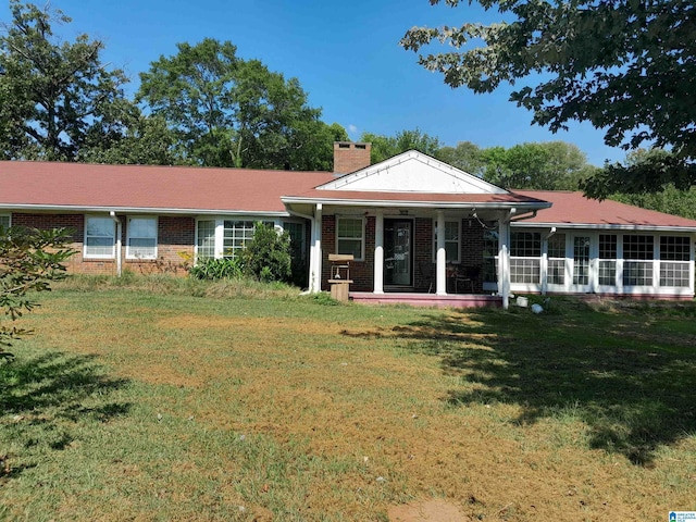 2041 Parkview Rd, Pelham, AL 35124 - view of front of home with a chimney, brick siding, and a front yard