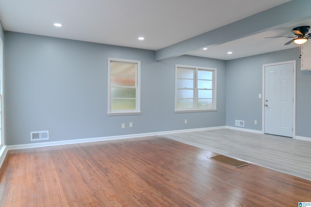 spare room featuring ceiling fan and light wood-type flooring