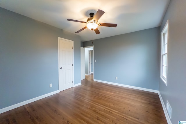 empty room featuring ceiling fan and wood-type flooring