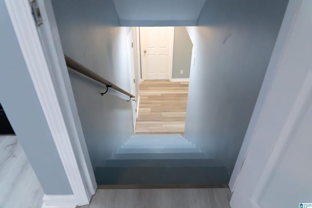 staircase featuring hardwood / wood-style floors