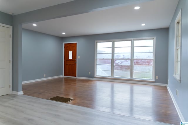 foyer entrance with light hardwood / wood-style floors