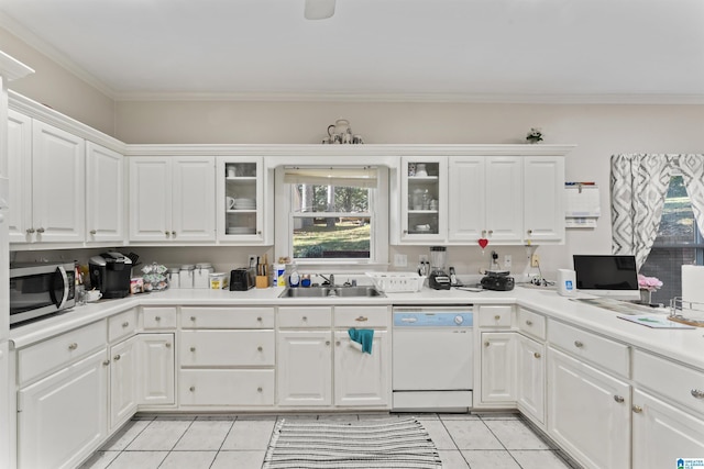 kitchen featuring white cabinets, white dishwasher, and sink