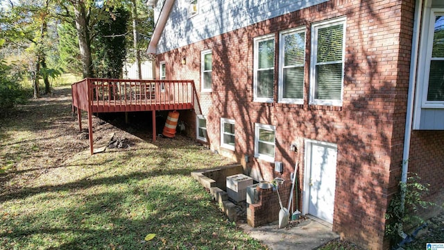 view of side of home with a wooden deck