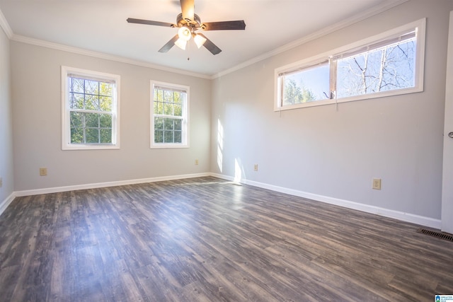 spare room featuring dark hardwood / wood-style floors, ceiling fan, and crown molding