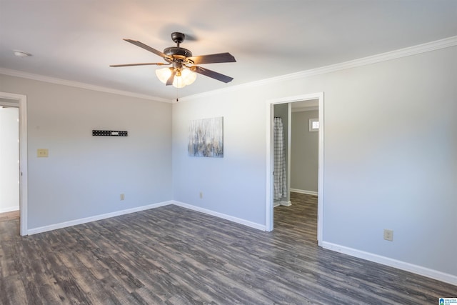 spare room with crown molding, ceiling fan, and dark wood-type flooring