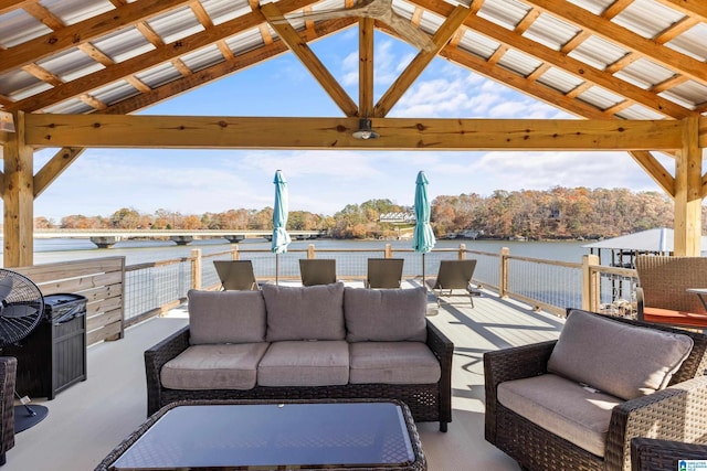 view of patio / terrace with a gazebo, an outdoor living space, and a water view