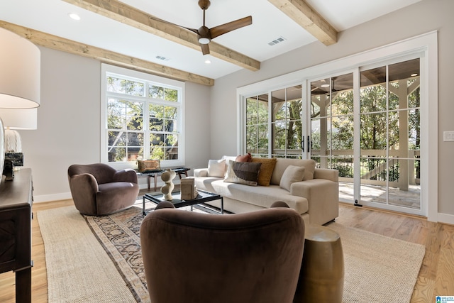 living room with ceiling fan, a healthy amount of sunlight, and light hardwood / wood-style flooring