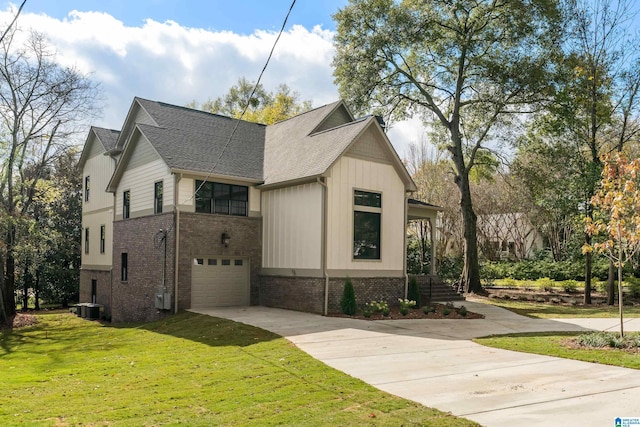 view of side of home featuring a lawn, a garage, and central air condition unit