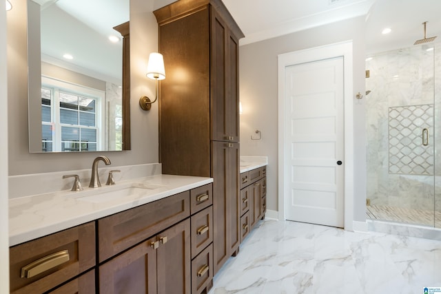 bathroom featuring vanity, an enclosed shower, and ornamental molding