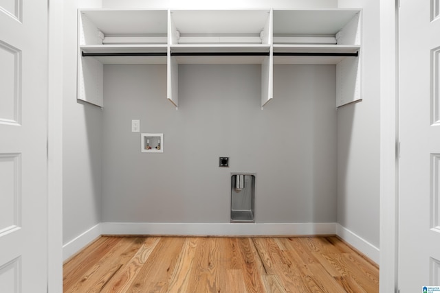 washroom with electric dryer hookup, hookup for a washing machine, and hardwood / wood-style flooring