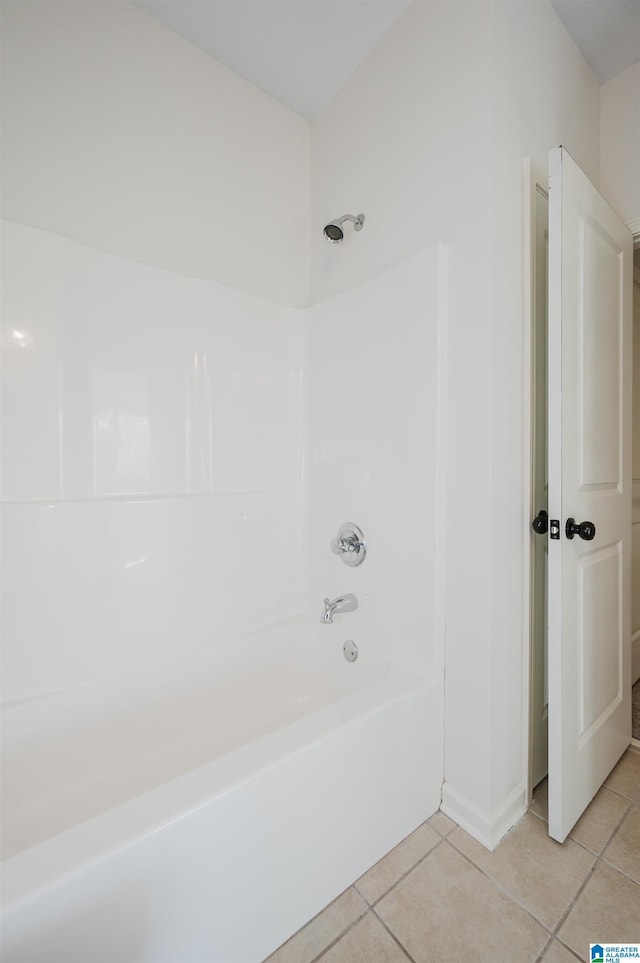 bathroom with tile patterned flooring and shower / bathtub combination