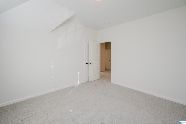 empty room featuring light carpet