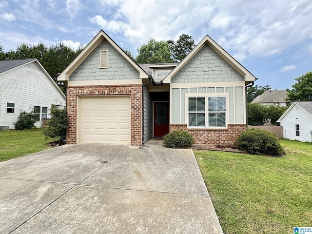 view of front of property featuring a garage and a front lawn