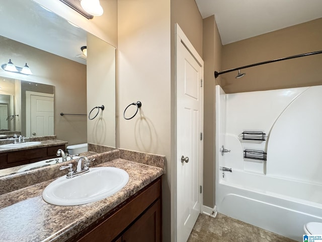 full bathroom featuring vanity, toilet, and tub / shower combination