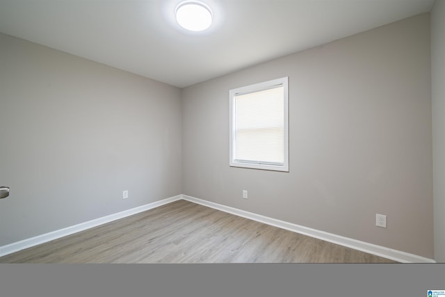 empty room with light hardwood / wood-style floors