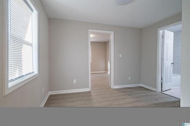 spare room with light wood-type flooring