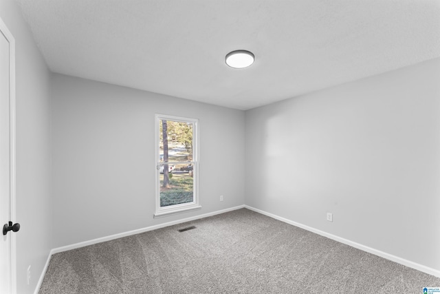 empty room with carpet flooring