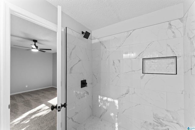 bathroom featuring tiled shower and ceiling fan