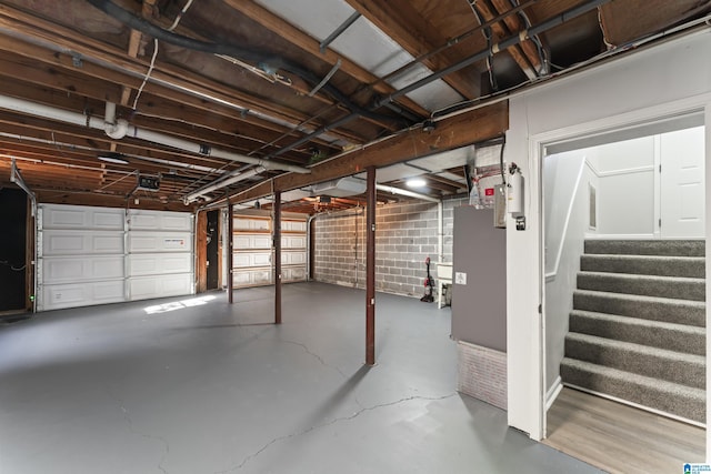 garage with electric panel and a garage door opener