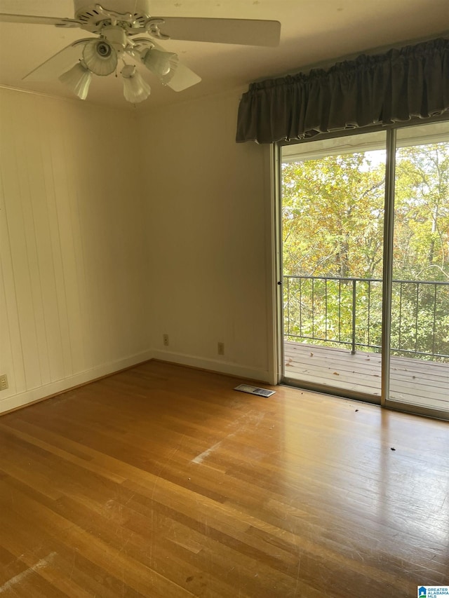 empty room featuring ceiling fan and light hardwood / wood-style floors