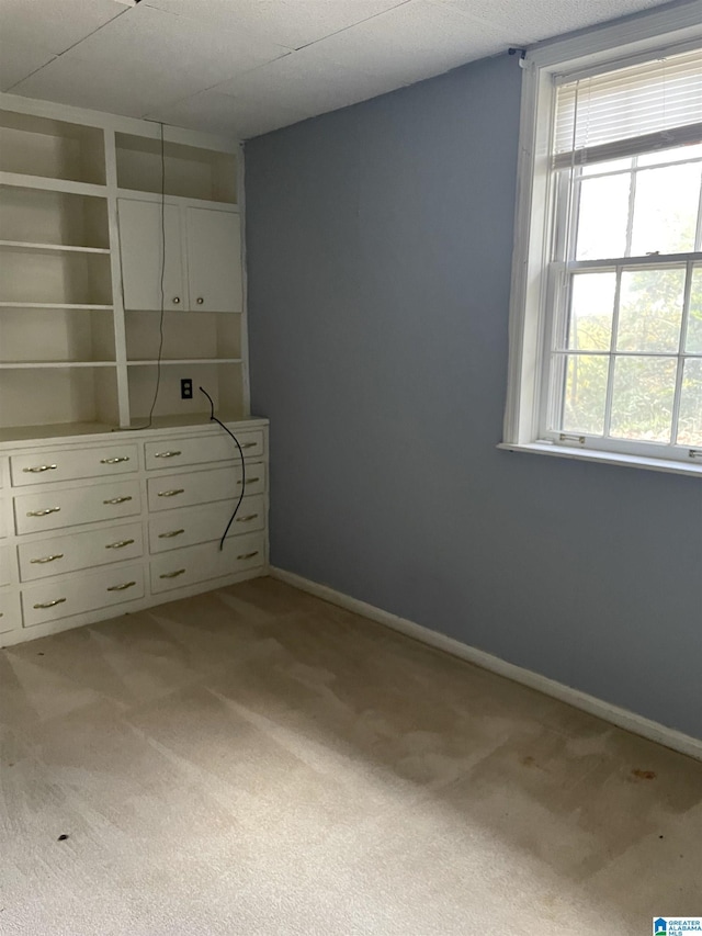 unfurnished bedroom featuring light colored carpet