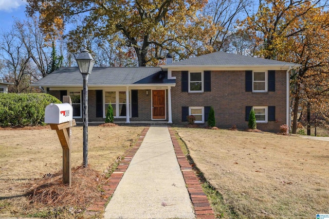 split level home featuring a front yard