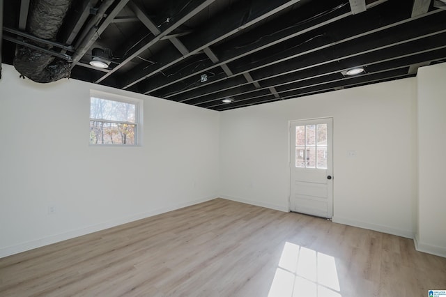 basement featuring light hardwood / wood-style flooring