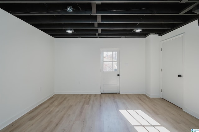 basement featuring light wood-type flooring